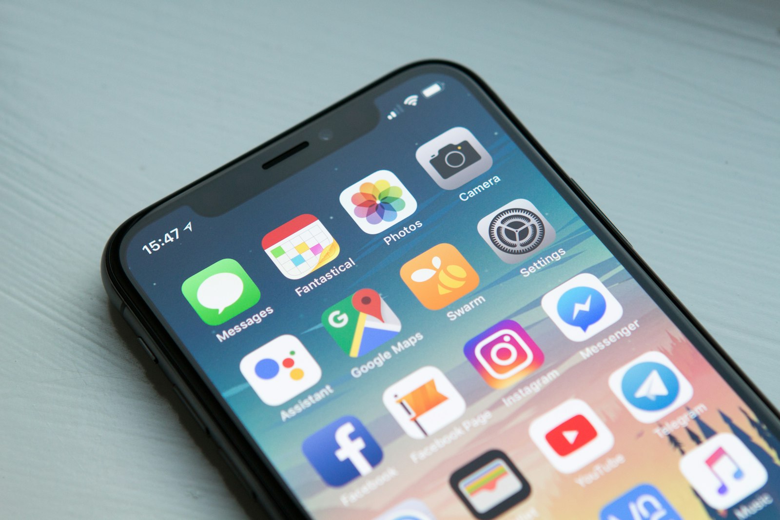 Smartphone home screen with messaging apps including Telegram